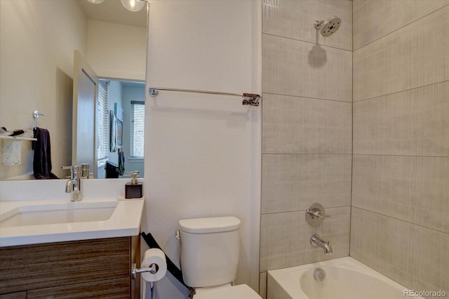 bathroom with shower / bathtub combination, toilet, and vanity