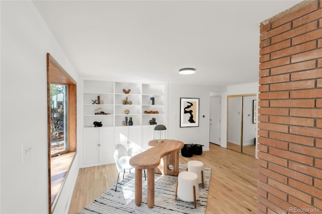 dining space with light wood finished floors