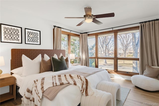 bedroom with wood finished floors and ceiling fan