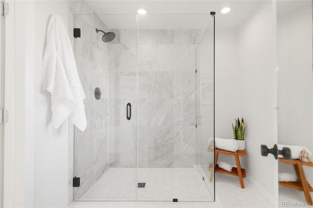 bathroom featuring recessed lighting, baseboards, and a stall shower