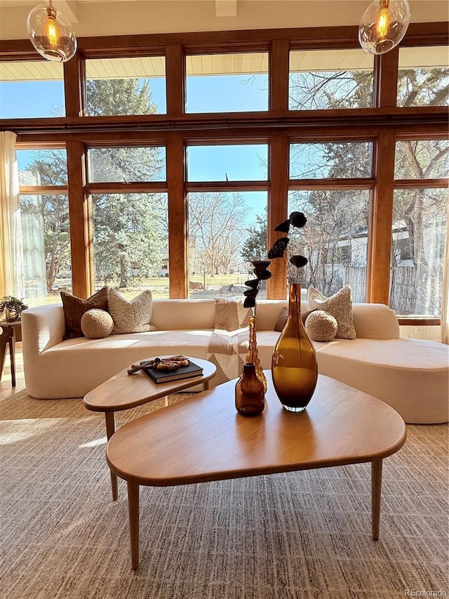 living room featuring a wall of windows