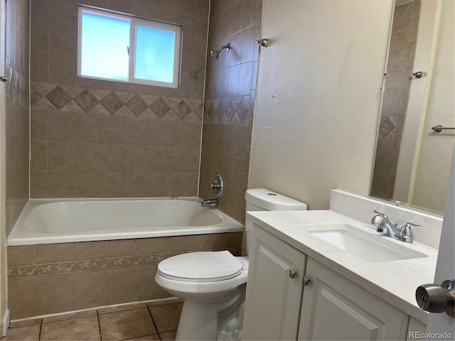 full bathroom with toilet, tile patterned flooring, vanity, and tiled shower / bath