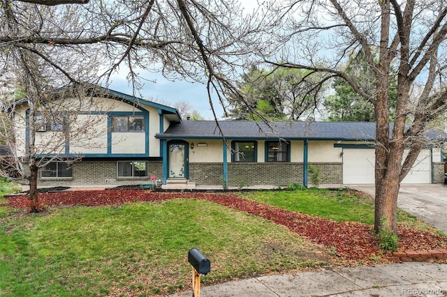 4290 N Nonchalant Cir, Colorado Springs, CO 80917 - split level home with brick siding, a front lawn, and an attached garage
