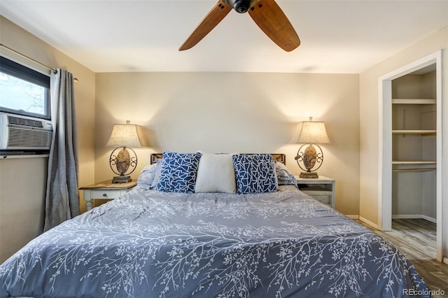 4290 N Nonchalant Cir, Colorado Springs, CO 80917 - bedroom featuring wood finished floors, a ceiling fan, baseboards, and cooling unit