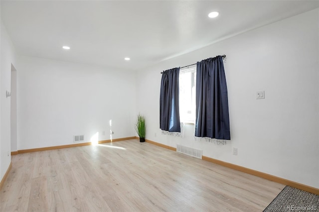 spare room with light wood-type flooring