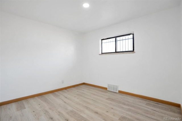 empty room featuring light hardwood / wood-style floors