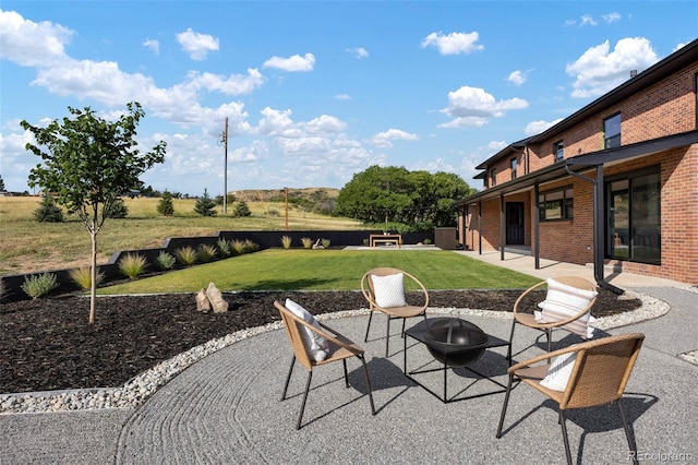 view of patio featuring a fire pit