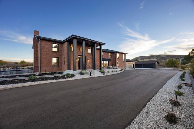 contemporary house featuring a mountain view and a garage