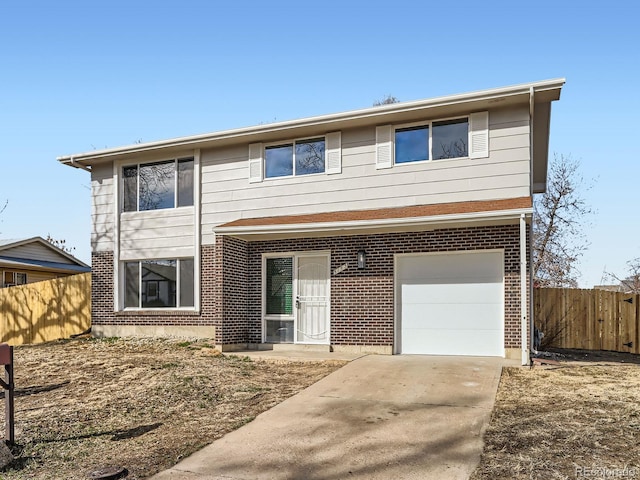 view of front facade with concrete driveway, a garage, fence, and brick siding