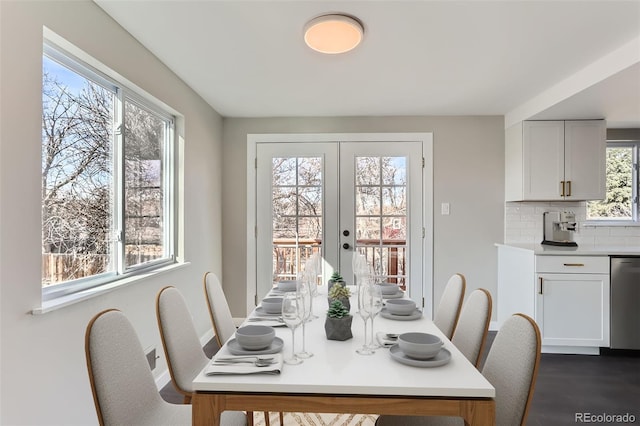 dining room with dark wood finished floors and french doors