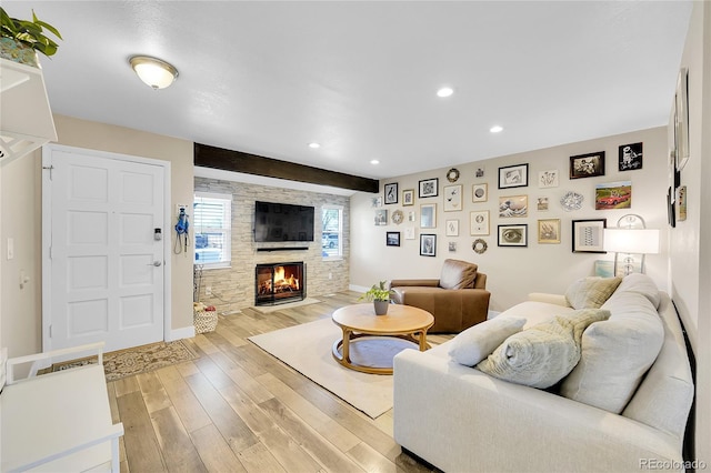 3561 W 131st Ave, Broomfield, CO 80020 - living area featuring a fireplace, wood finished floors, baseboards, and recessed lighting
