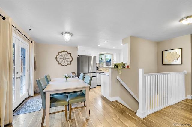 3561 W 131st Ave, Broomfield, CO 80020 - dining area featuring light wood-style floors, recessed lighting, and baseboards