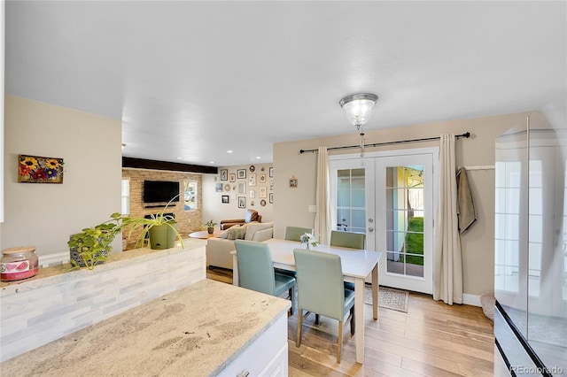3561 W 131st Ave, Broomfield, CO 80020 - dining area featuring french doors, light wood-type flooring, recessed lighting, and baseboards