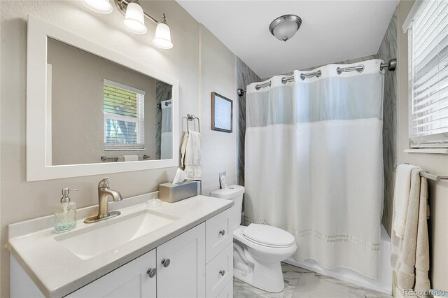 3561 W 131st Ave, Broomfield, CO 80020 - full bathroom featuring marble finish flooring, vanity, toilet, and shower / bath combo with shower curtain
