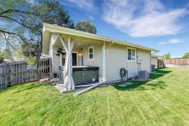 3561 W 131st Ave, Broomfield, CO 80020 - back of house featuring a hot tub and central air condition unit