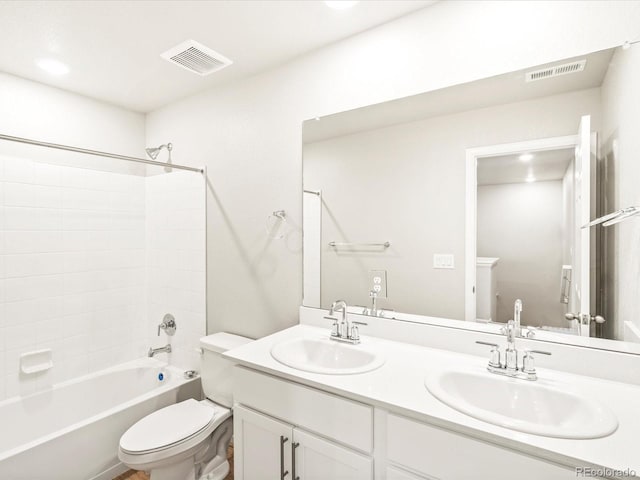 full bathroom with toilet, visible vents, and a sink