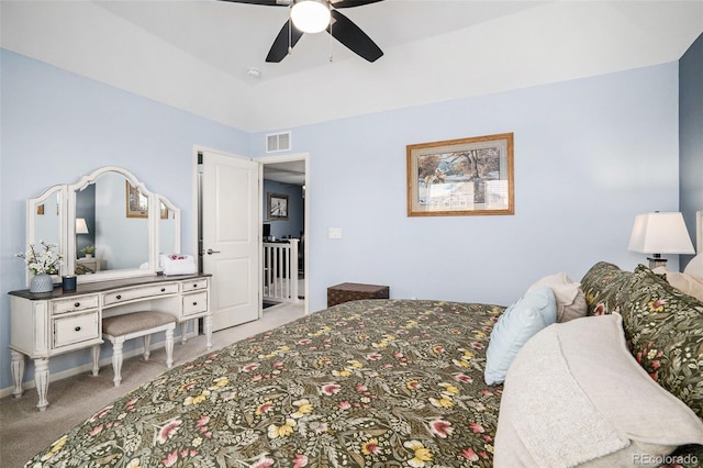 bedroom with carpet floors, baseboards, visible vents, and a ceiling fan