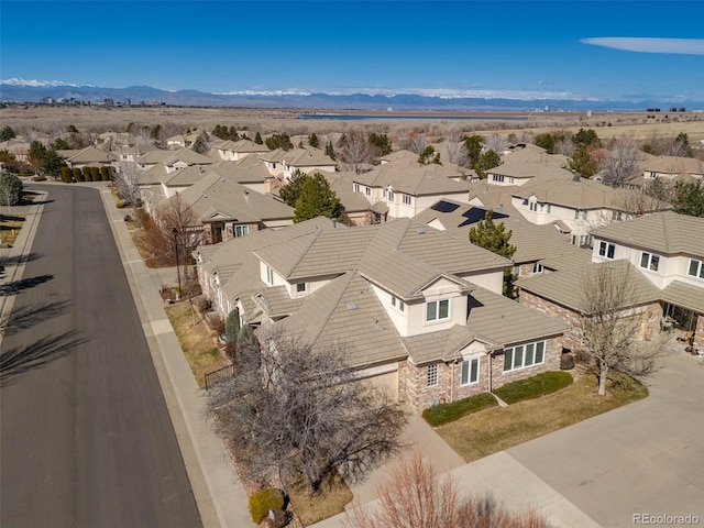 birds eye view of property featuring a mountain view and a residential view