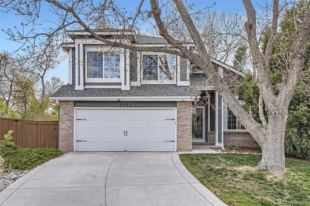 view of front facade featuring fence, an attached garage, brick siding, concrete driveway, and a shingled roof