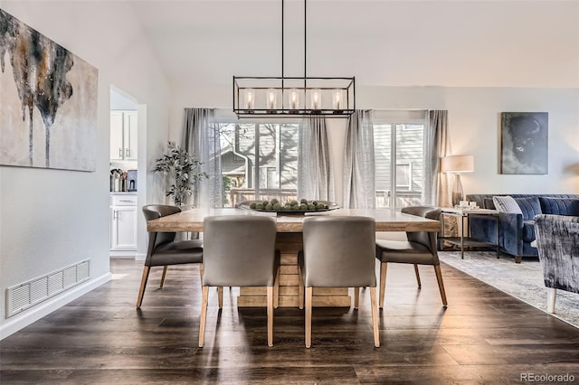 dining space featuring visible vents and dark wood-type flooring