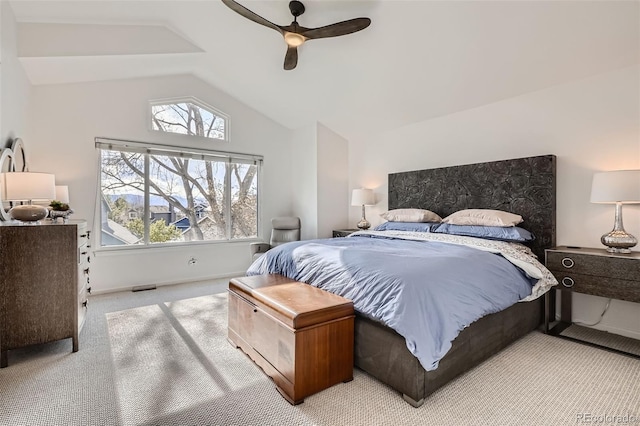 bedroom featuring ceiling fan, carpet, and vaulted ceiling
