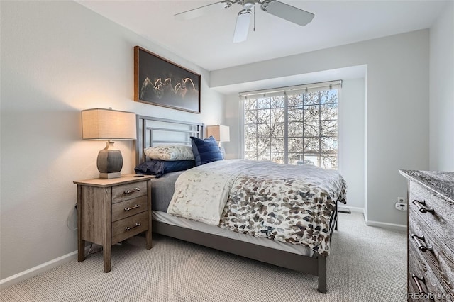 bedroom featuring baseboards, light carpet, and ceiling fan