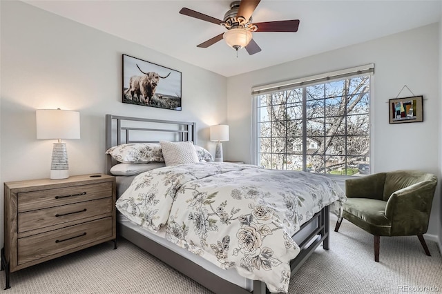 bedroom with light carpet and ceiling fan
