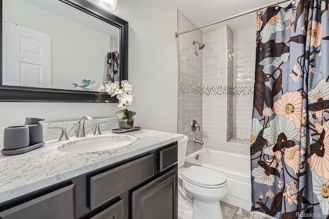 full bath featuring toilet, vanity, and shower / tub combo
