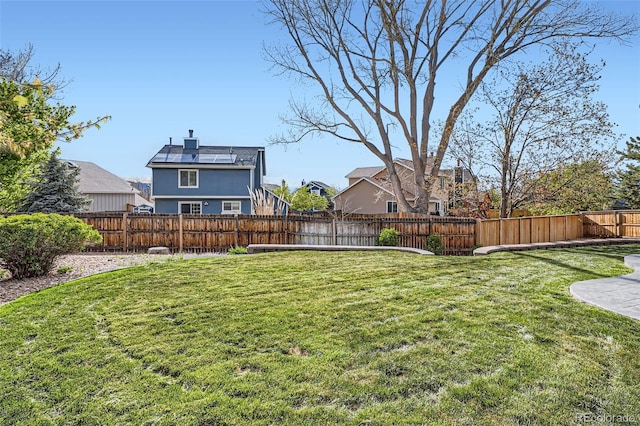 view of yard with a residential view and a fenced backyard