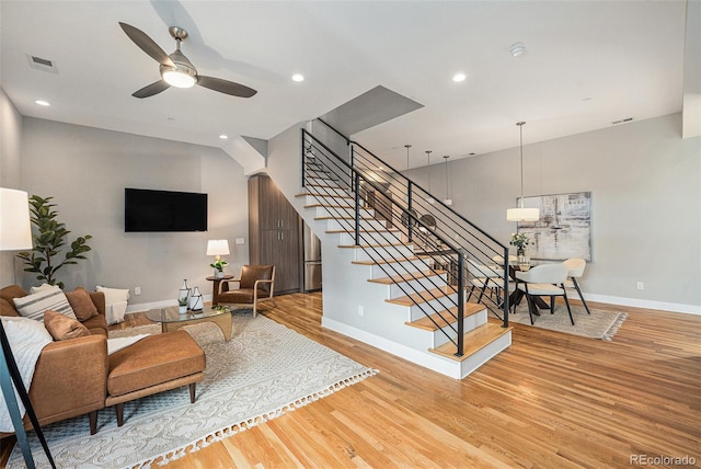 4144 Tennyson St Unit 212, Denver, CO 80212 - living area featuring baseboards, stairs, wood finished floors, and recessed lighting