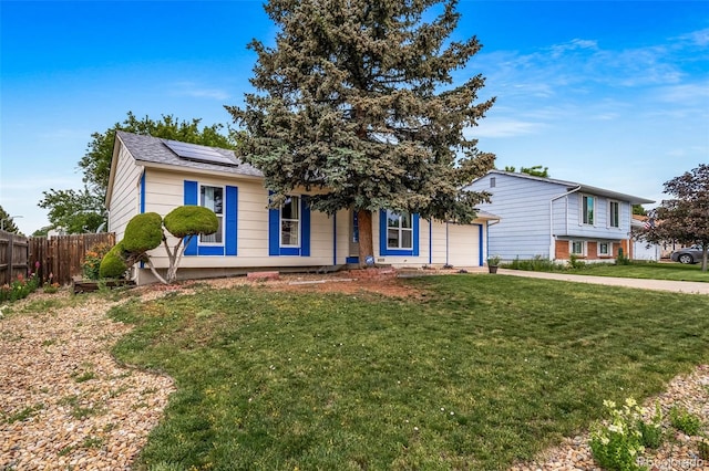 10007 Bryant St, Denver, CO 80260 - view of front facade with roof mounted solar panels, an attached garage, and a porch