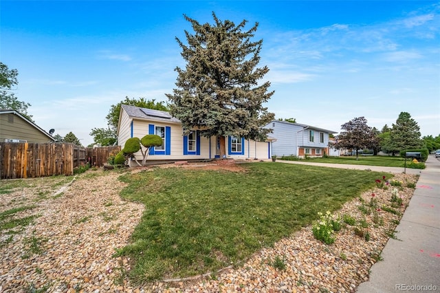 10007 Bryant St, Denver, CO 80260 - view of front of property featuring roof mounted solar panels and a garage