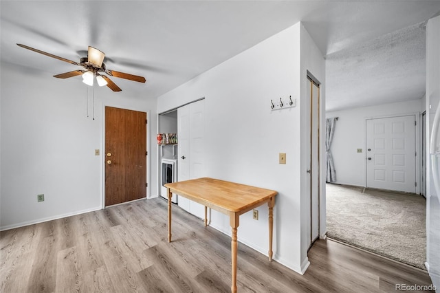 10007 Bryant St, Denver, CO 80260 - foyer entrance with ceiling fan, wood finished floors, and baseboards