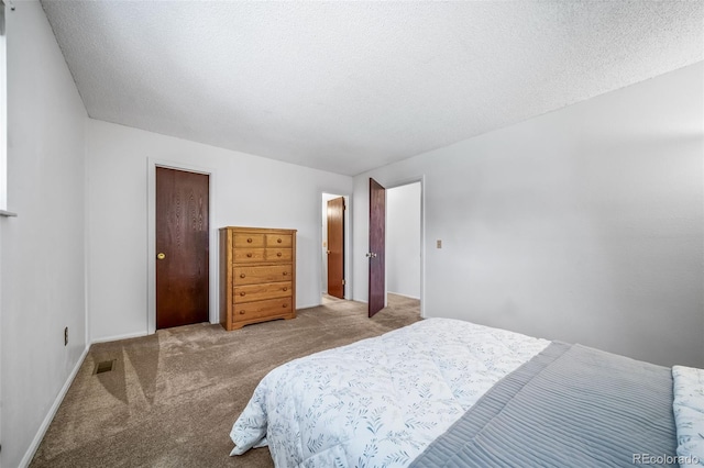 10007 Bryant St, Denver, CO 80260 - bedroom with carpet floors, a textured ceiling, and baseboards