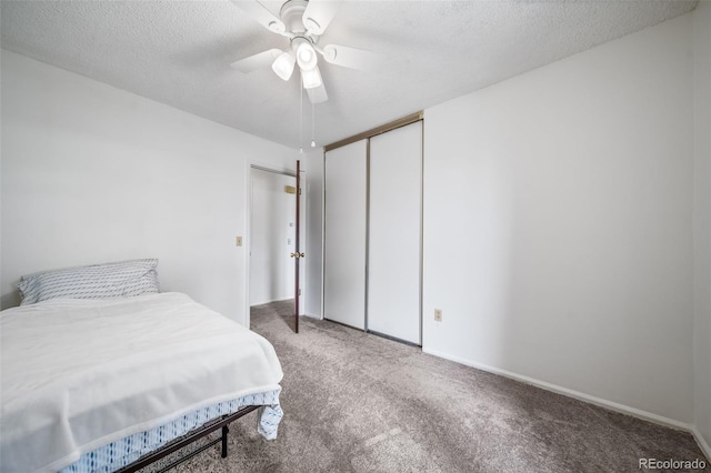 10007 Bryant St, Denver, CO 80260 - carpeted bedroom with a textured ceiling, a closet, a ceiling fan, and baseboards