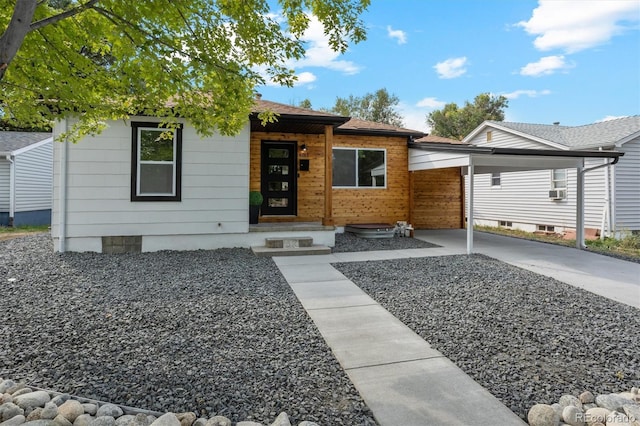 view of front of home featuring a carport