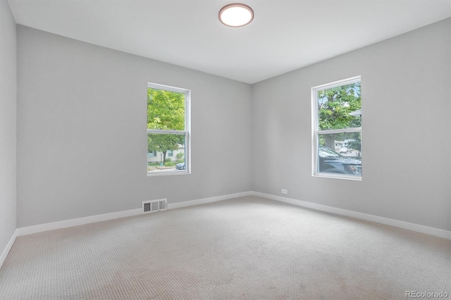 unfurnished room featuring carpet