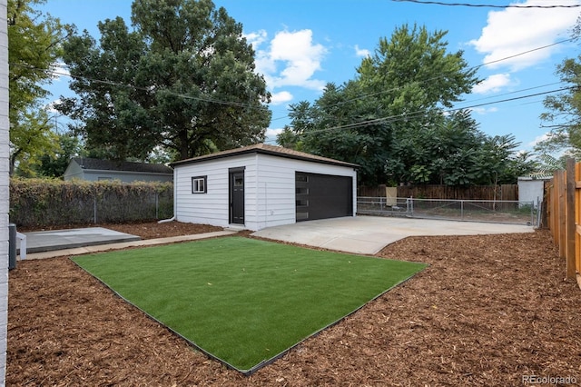 view of yard with an outbuilding and a garage