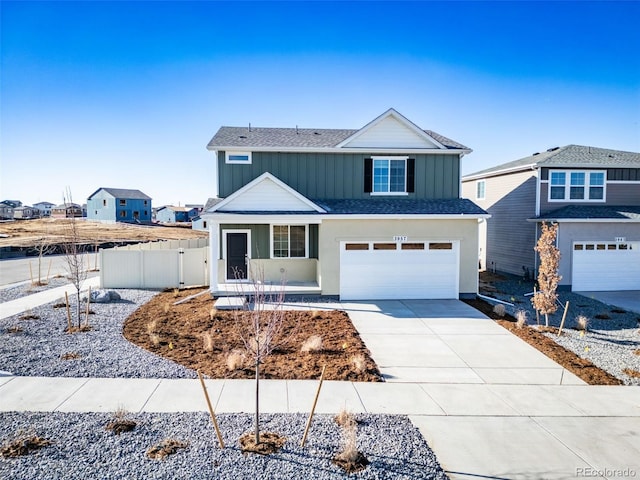 3889 N Shawee St, Aurora, CO 80019 - traditional-style home with an attached garage, concrete driveway, and a shingled roof