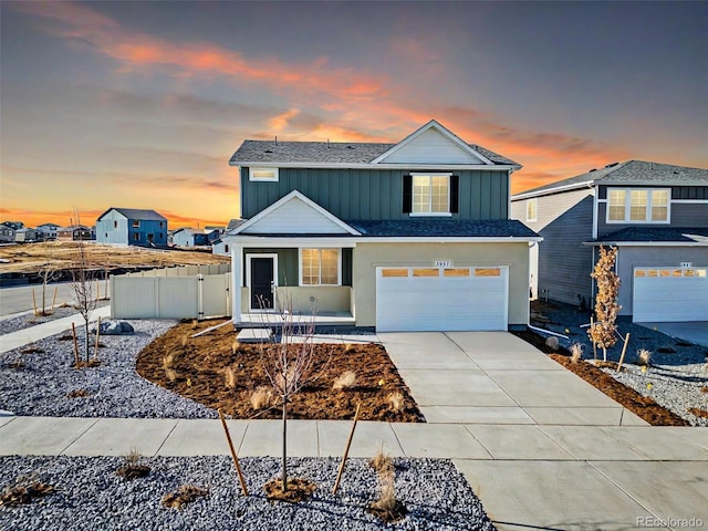 3889 N Shawee St, Aurora, CO 80019 - traditional-style home featuring a garage, roof with shingles, and concrete driveway