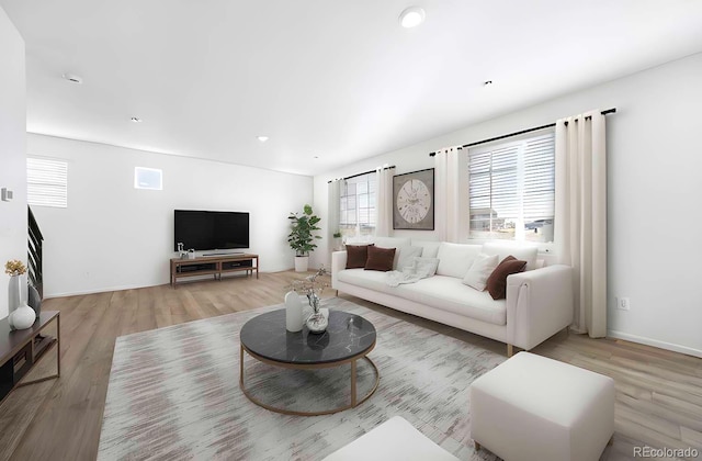 3889 N Shawee St, Aurora, CO 80019 - living room featuring wood finished floors and baseboards