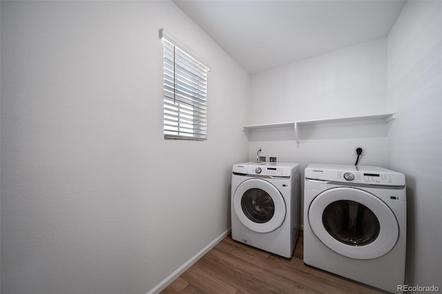 3889 N Shawee St, Aurora, CO 80019 - laundry area featuring independent washer and dryer, wood finished floors, and baseboards