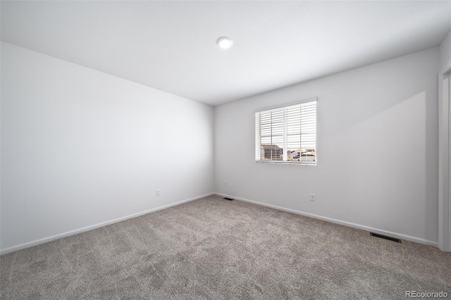 3889 N Shawee St, Aurora, CO 80019 - carpeted spare room featuring baseboards