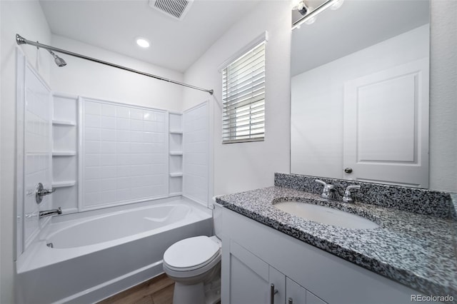 3889 N Shawee St, Aurora, CO 80019 - bathroom with bathtub / shower combination, vanity, wood finished floors, and toilet