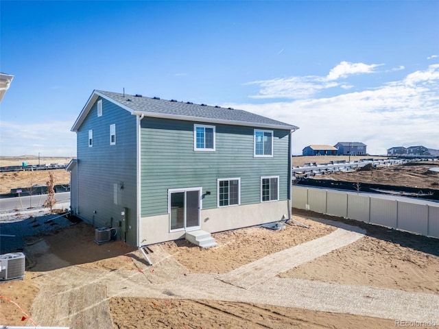 3889 N Shawee St, Aurora, CO 80019 - rear view of property with central air condition unit and entry steps