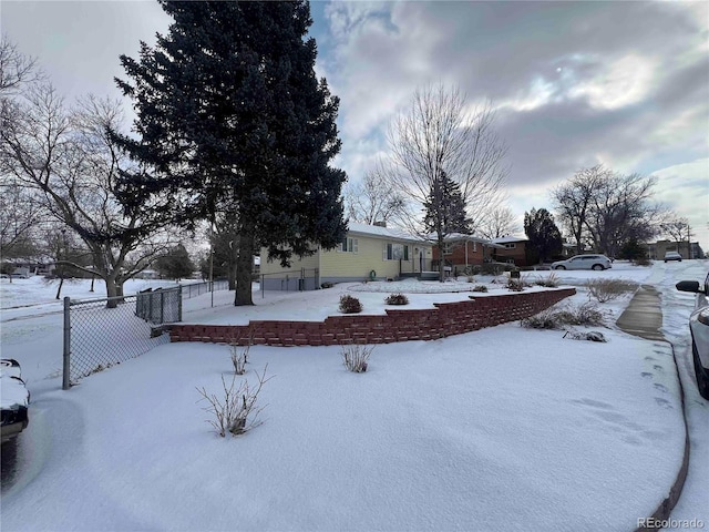 view of yard layered in snow