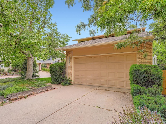 4032 S Atchison Way, Aurora, CO 80014 - garage featuring concrete driveway