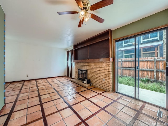 4032 S Atchison Way, Aurora, CO 80014 - unfurnished living room featuring a brick fireplace, a ceiling fan, and light tile patterned flooring