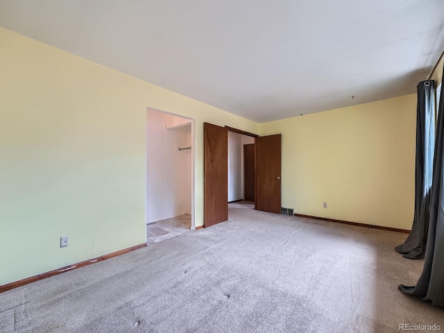 4032 S Atchison Way, Aurora, CO 80014 - spare room featuring light colored carpet and baseboards