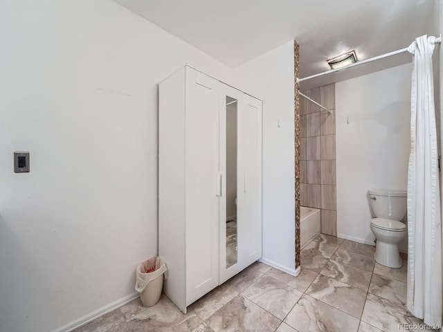 4032 S Atchison Way, Aurora, CO 80014 - full bathroom featuring marble look tile flooring and shower / tub combo with curtain